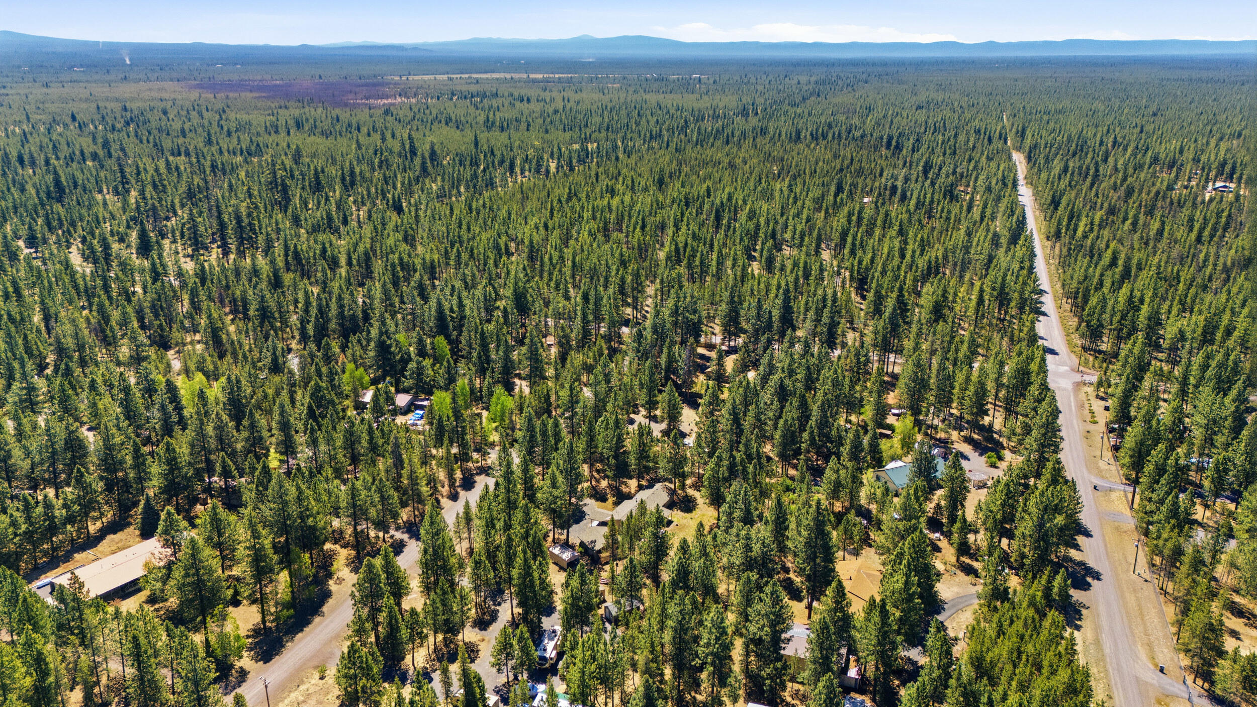 50868 Doe Loop La Pine, OR 97739 - Photo 51 of 51 a view of a lush green outdoor space with a lake view