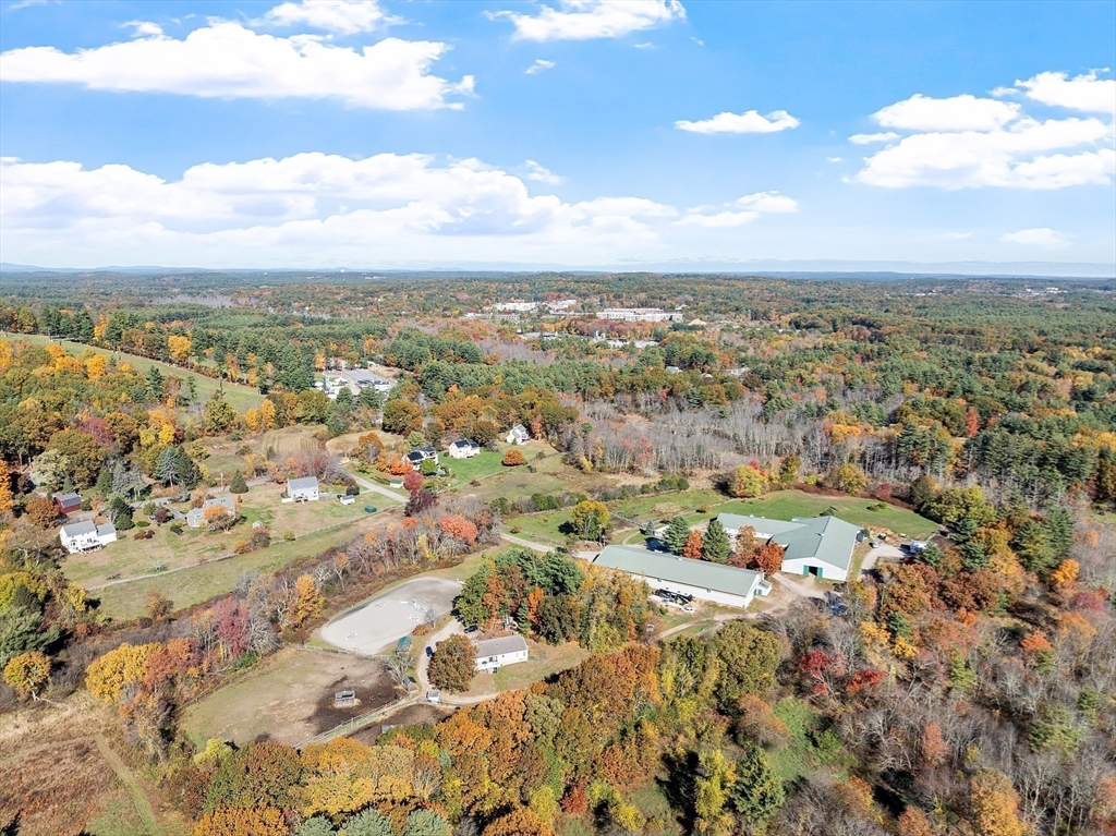 84 Powers Road Westford, MA 01886 - Photo 3 of 42 an aerial view of residential building with parking space