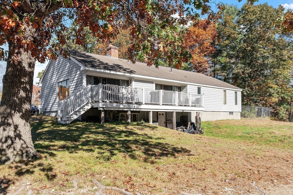 84 Powers Road Westford, MA 01886 - Photo 33 of 42 a front view of a house with a yard
