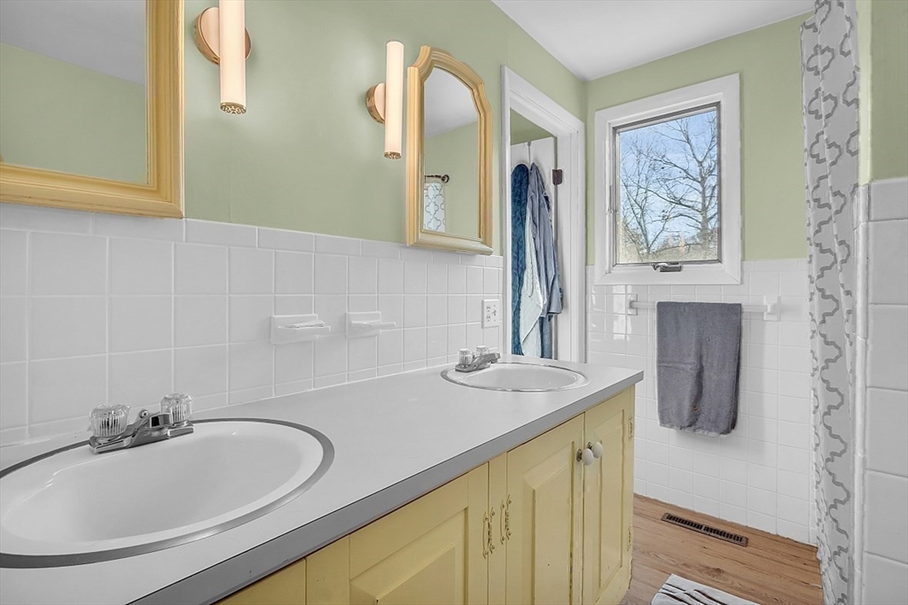 84 Powers Road Westford, MA 01886 - Photo 38 of 42 a bathroom with a sink and a mirror