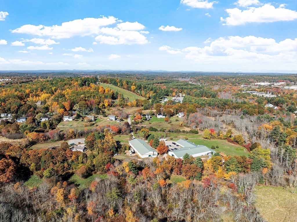 84 Powers Road Westford, MA 01886 - Photo 5 of 42 an aerial view of residential building and trees
