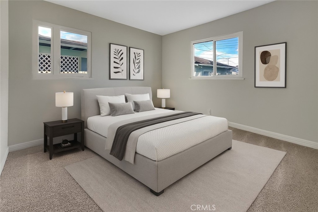 380 Harvard Street Oxnard, CA 93036 - Photo 11 of 14 a bedroom with a bed and night stand