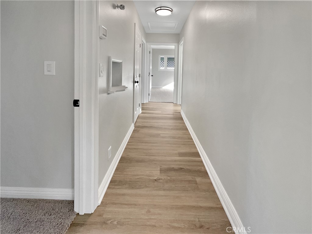 380 Harvard Street Oxnard, CA 93036 - Photo 7 of 14 a view of a hallway with wooden floor and staircase