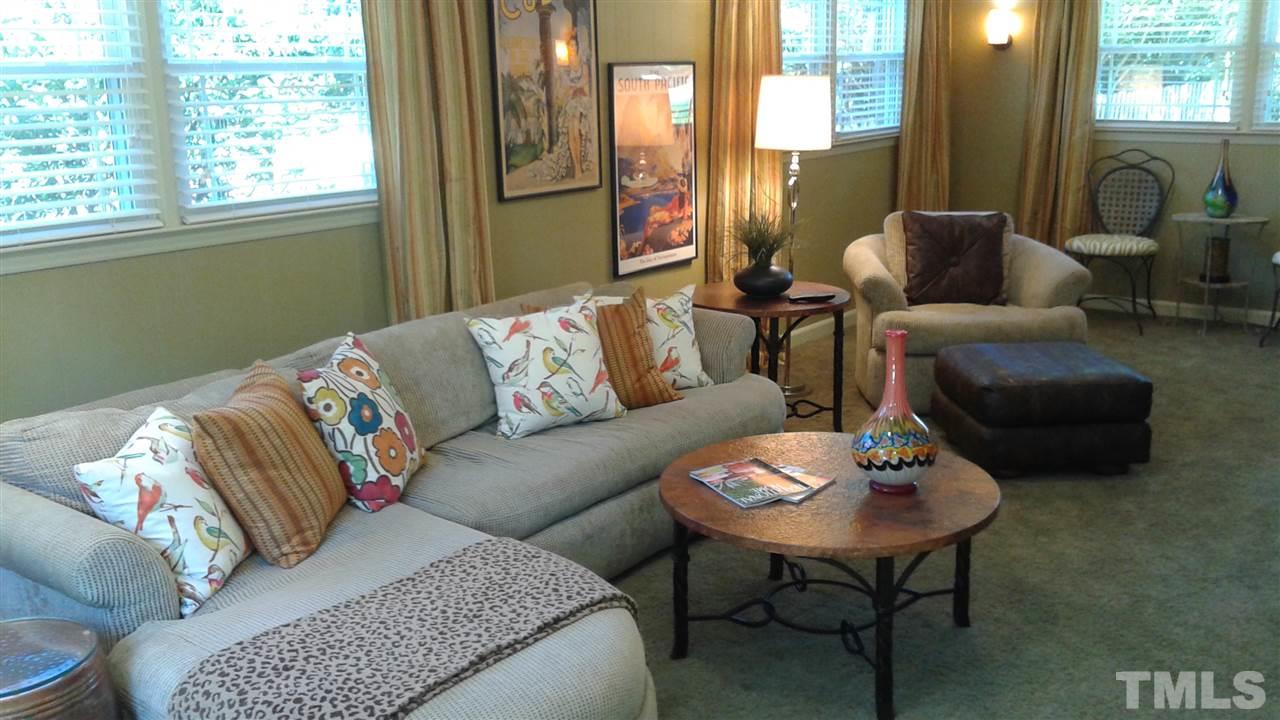 204 Sampson Street Raleigh, NC 27609 - Photo 18 of 22 a living room with furniture and a large window