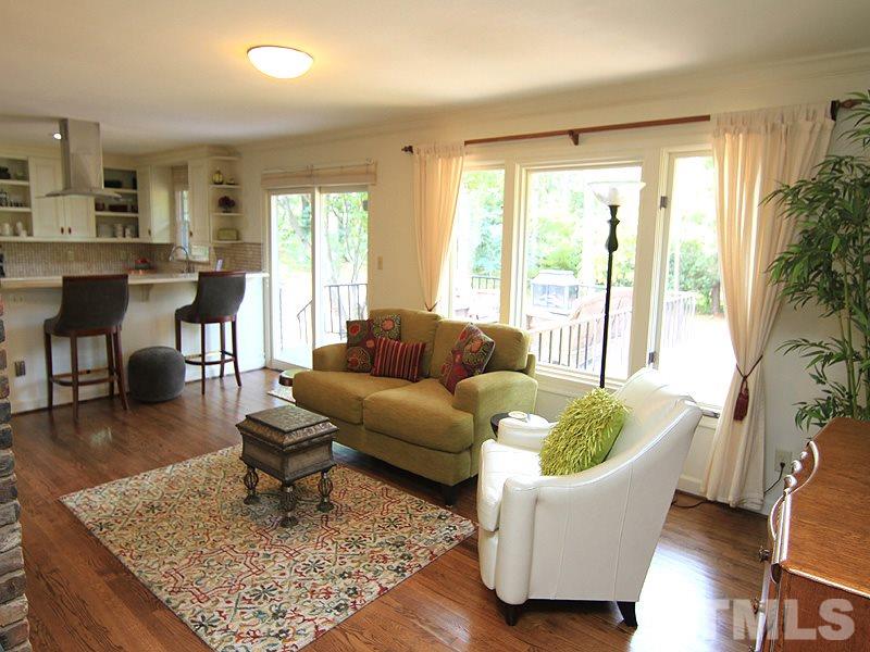 204 Sampson Street Raleigh, NC 27609 - Photo 9 of 22 a living room with furniture and a rug