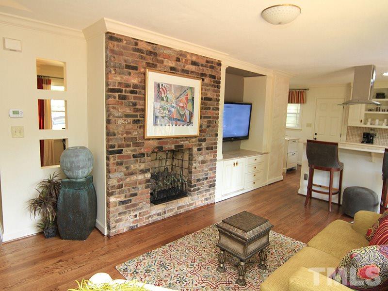 204 Sampson Street Raleigh, NC 27609 - Photo 10 of 22 a living room with furniture and a fireplace
