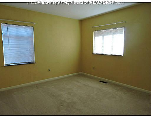 6243 Rosalind Road Huntington, WV 25705 - Photo 11 of 16 Master Bedroom. Master Bedroom carpet and cedar lined closet.