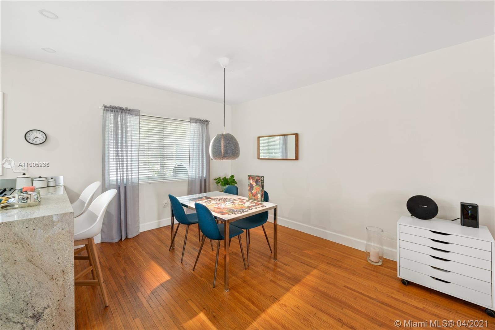 4780 Pine Tree Drive, Unit 9 Miami Beach, FL 33140 - Photo 12 of 21 a living room with furniture and wooden floor
