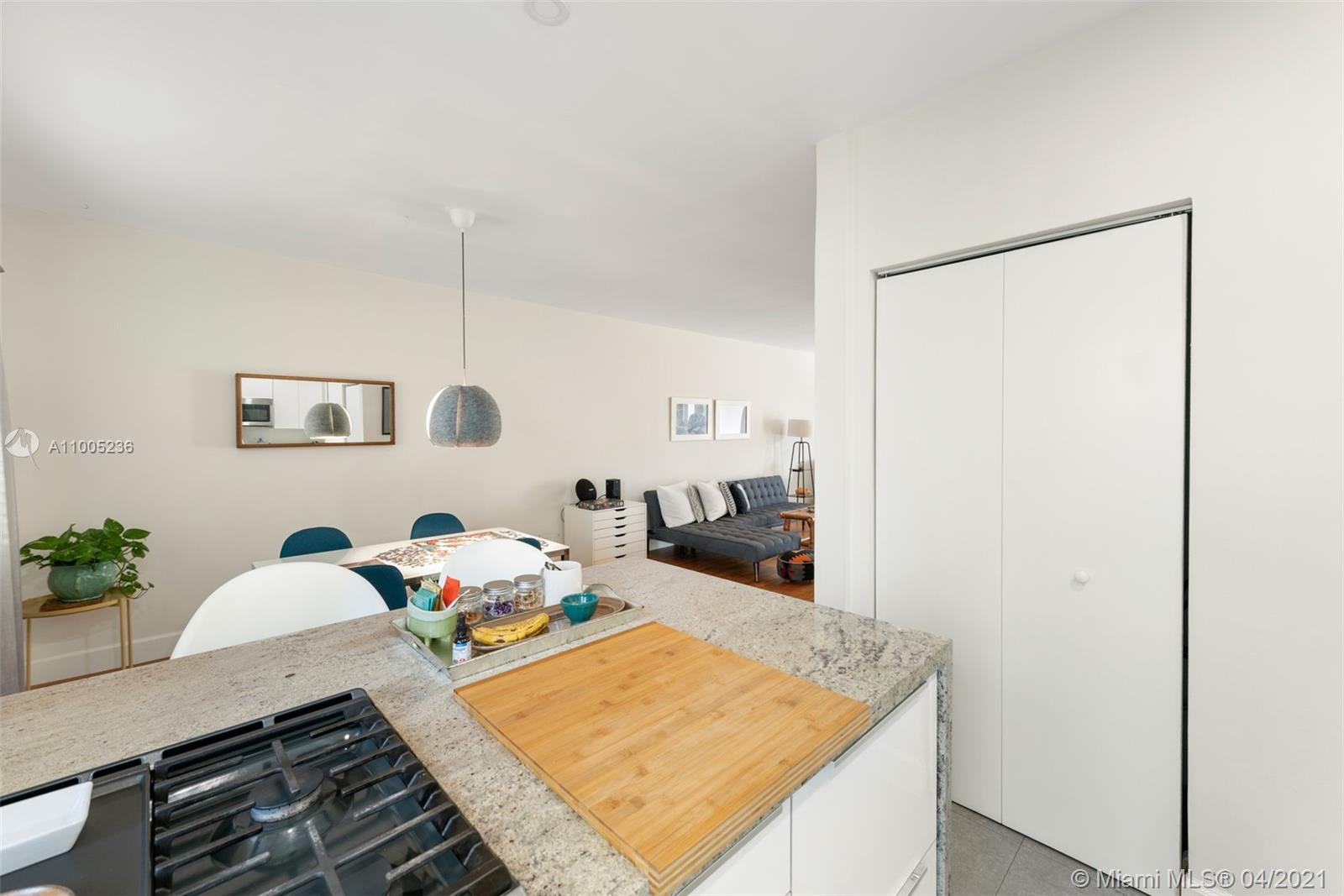 4780 Pine Tree Drive, Unit 9 Miami Beach, FL 33140 - Photo 13 of 21 a living room with furniture and wooden floor