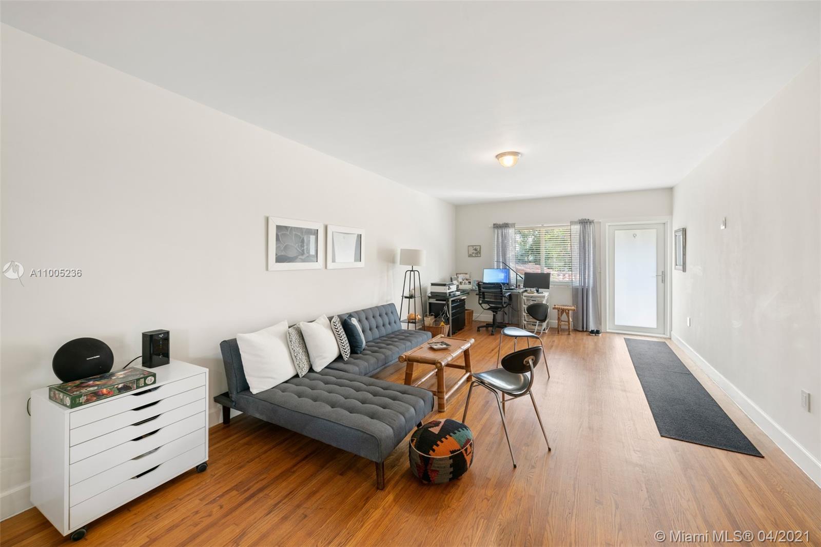 4780 Pine Tree Drive, Unit 9 Miami Beach, FL 33140 - Photo 14 of 21 a living room with furniture and a wooden floor