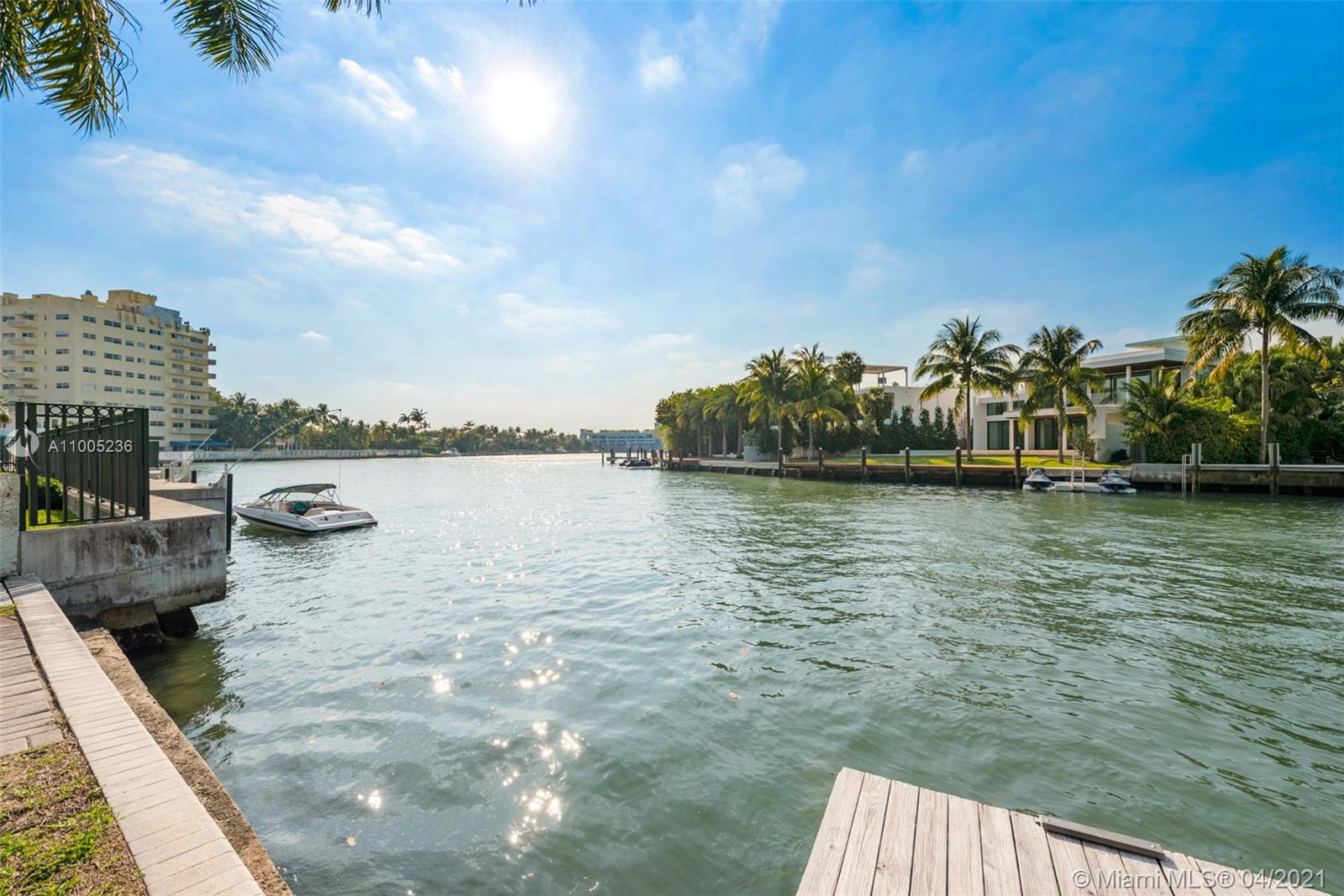 4780 Pine Tree Drive, Unit 9 Miami Beach, FL 33140 - Photo 20 of 21 a view of a lake with houses