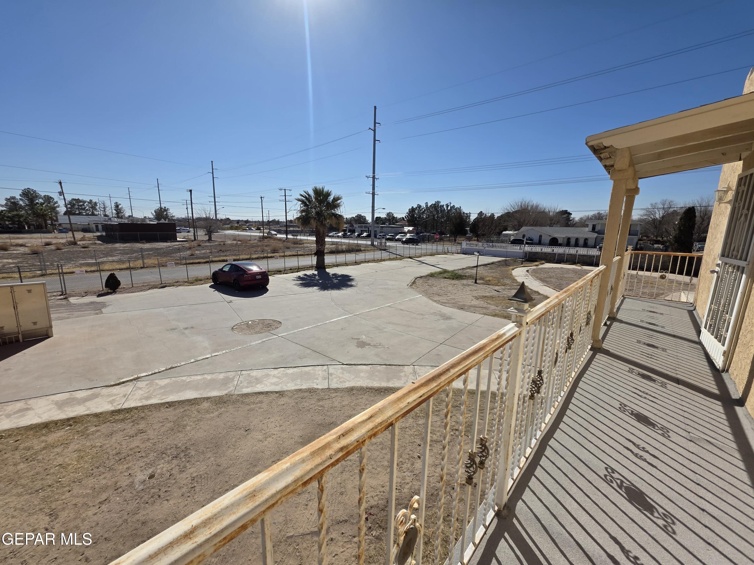 11661 Socorro Road Socorro, TX 79927 - Photo 7 of 32 a view of a terrace with wooden floor and iron stairs