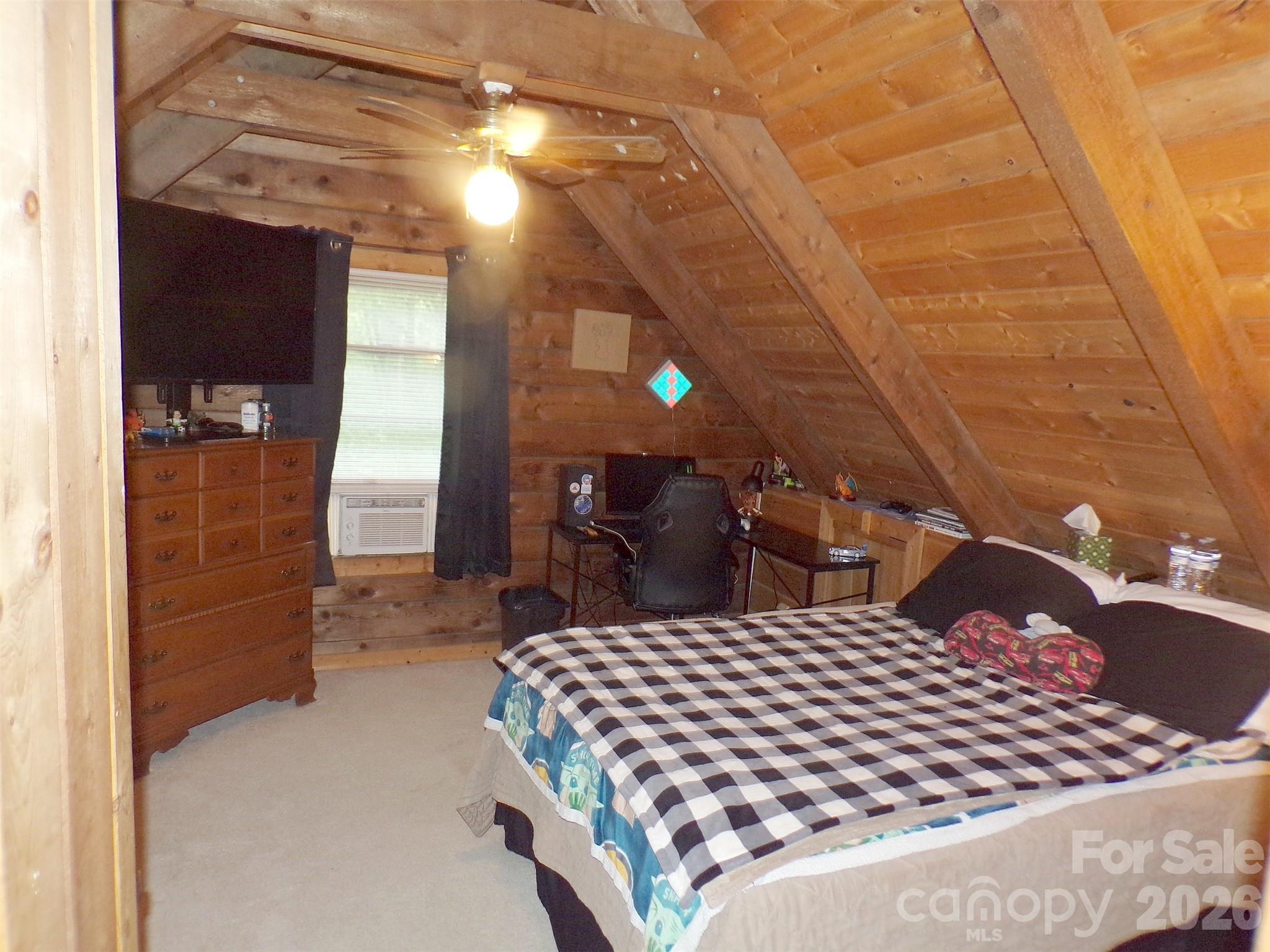 216 Paradise Road Hendersonville, NC 28792 - Photo 13 of 33 a bedroom with a bed and a walk in closet