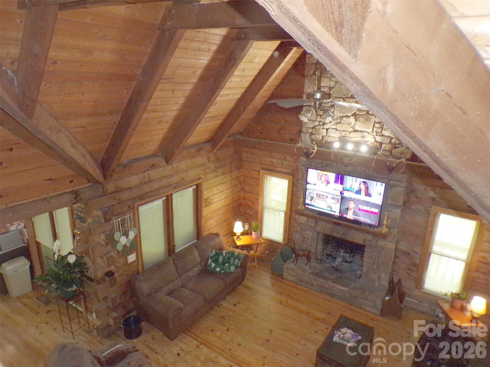 216 Paradise Road Hendersonville, NC 28792 - Photo 14 of 33 a living room with furniture and a flat screen tv