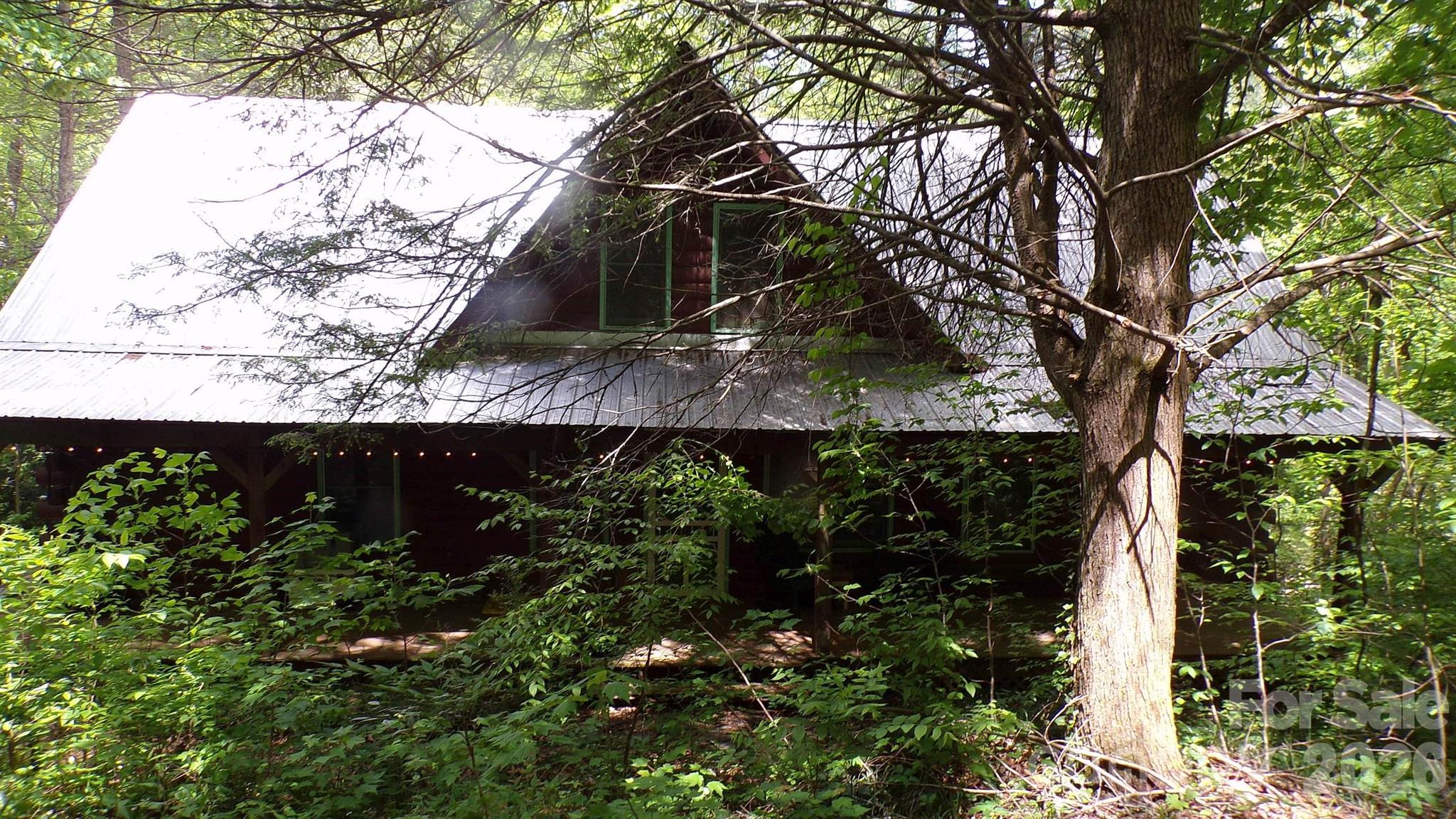 216 Paradise Road Hendersonville, NC 28792 - Photo 2 of 33 a view of house with green space