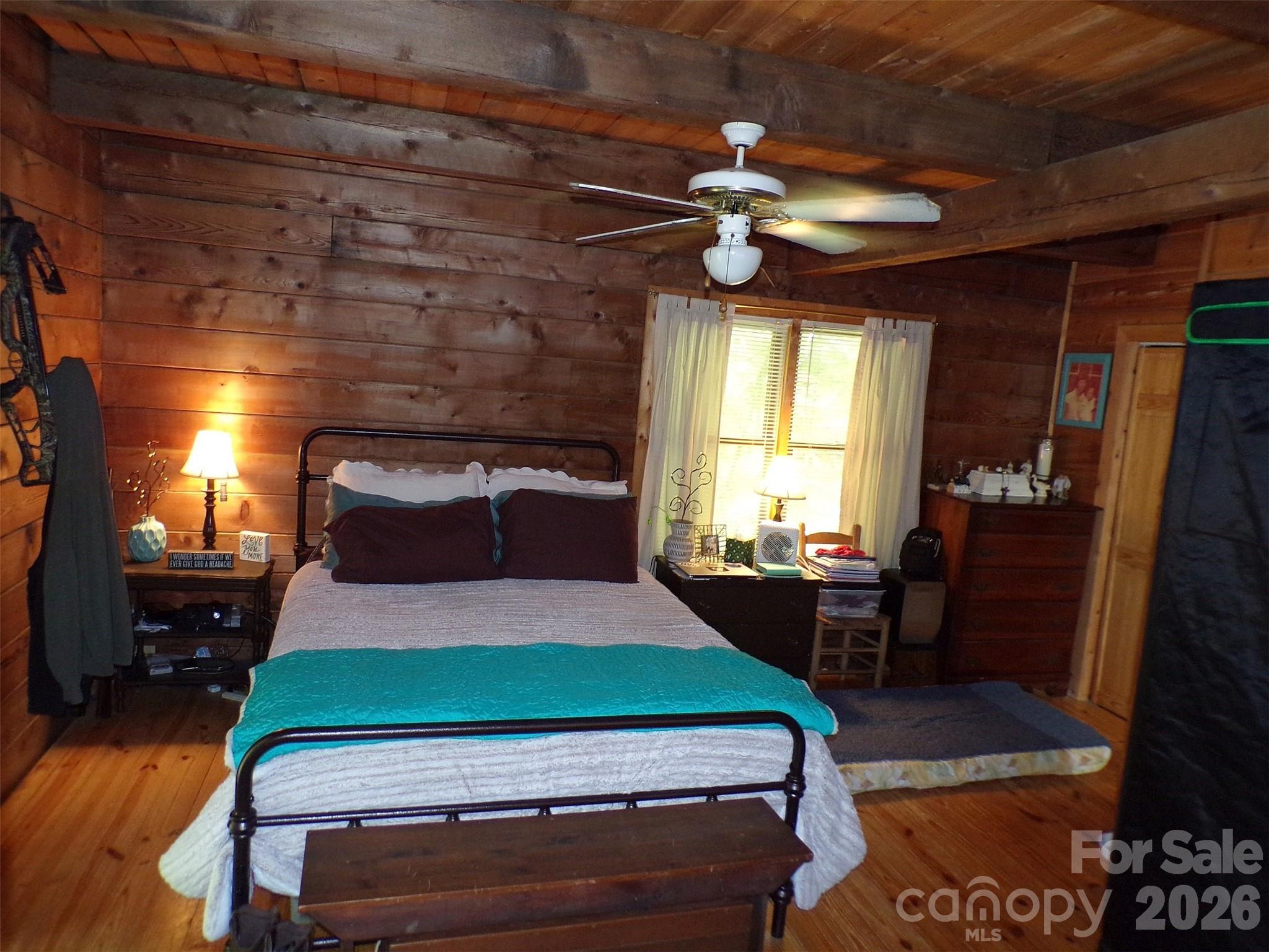 216 Paradise Road Hendersonville, NC 28792 - Photo 8 of 33 a bedroom with a bed and a window