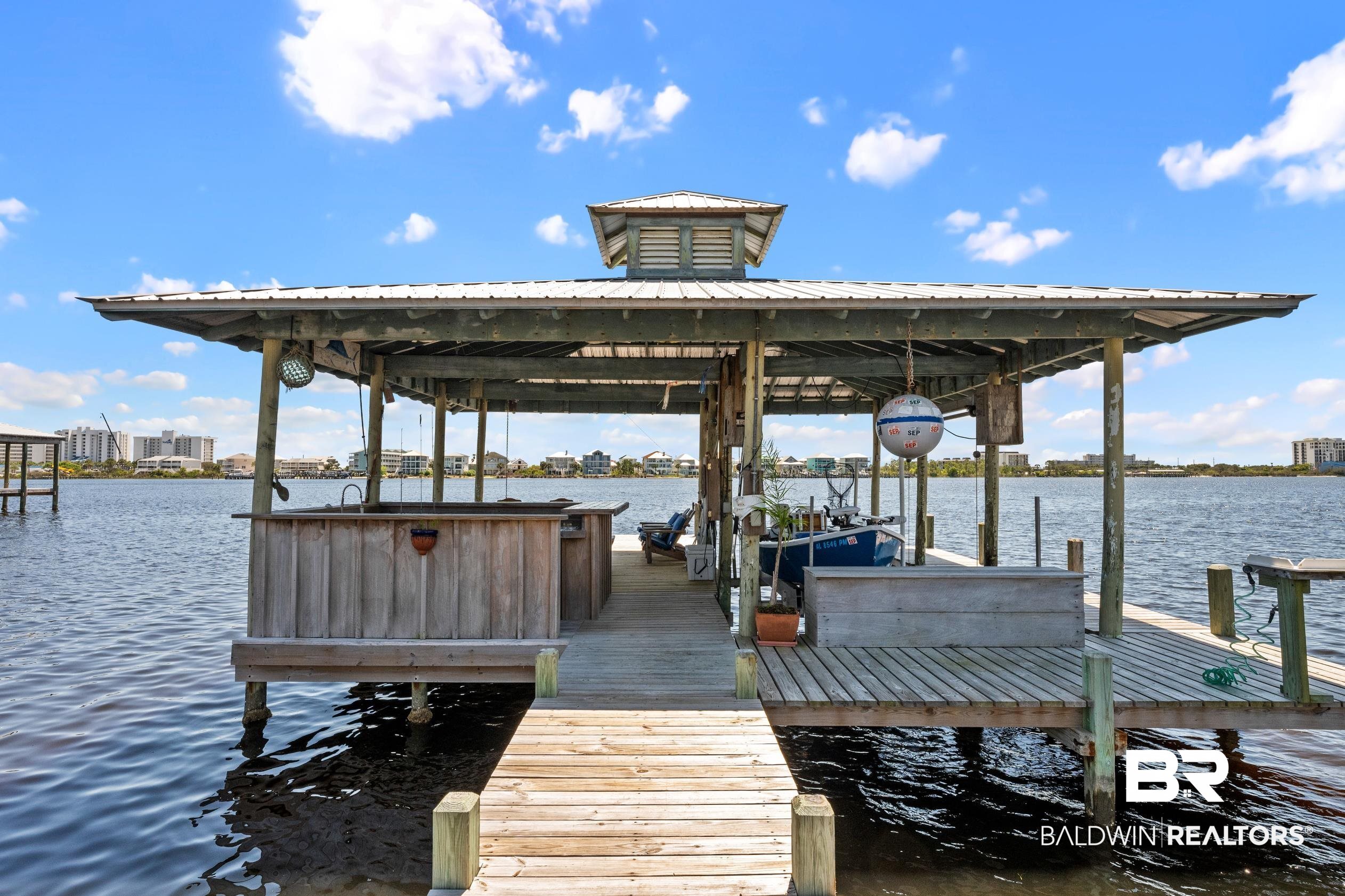 31304 River Road Orange Beach, AL 36561 - Photo 56 of 78 Dock area featuring boat lift and a water view
