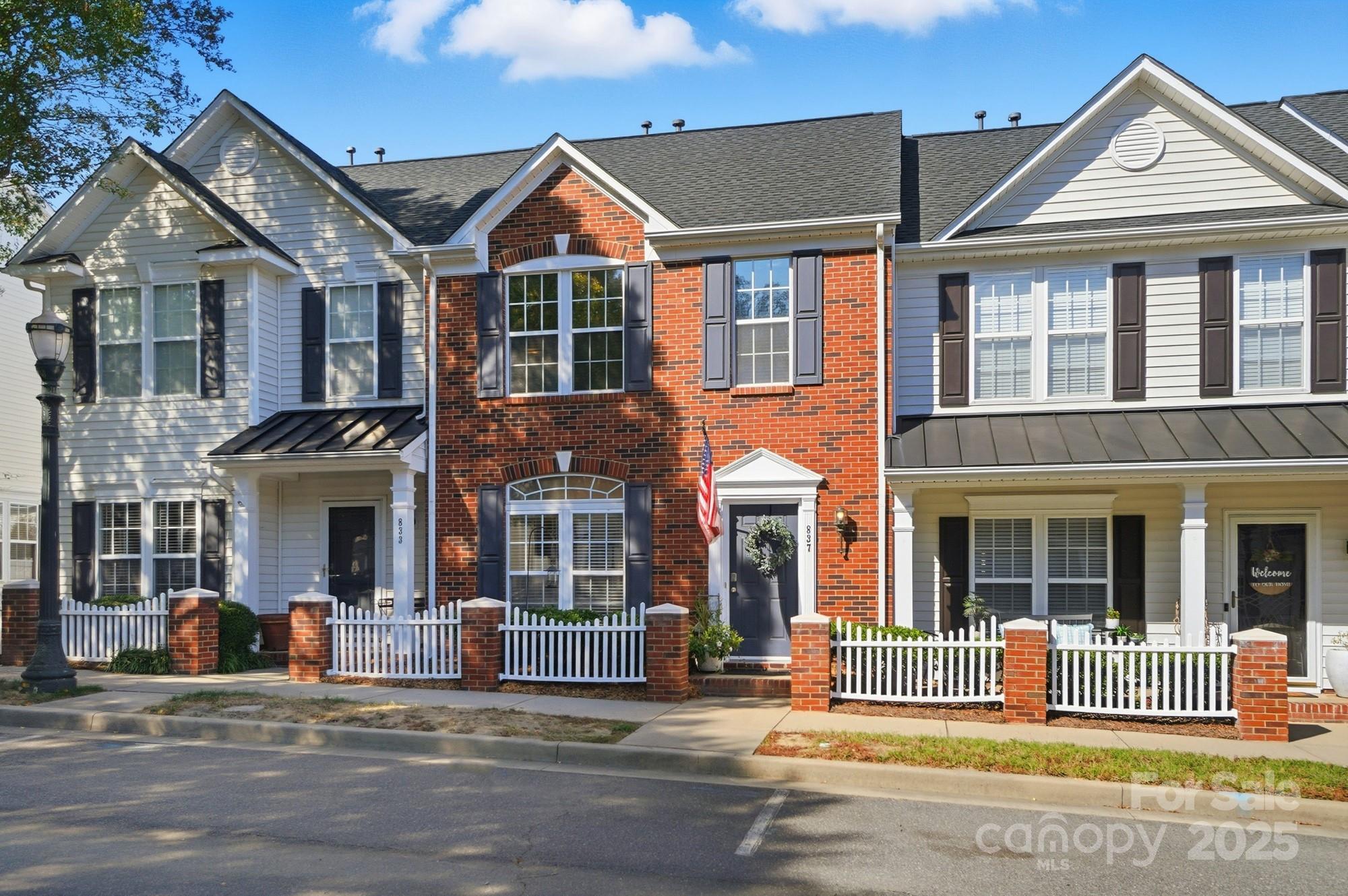 front view of a house with a small yard