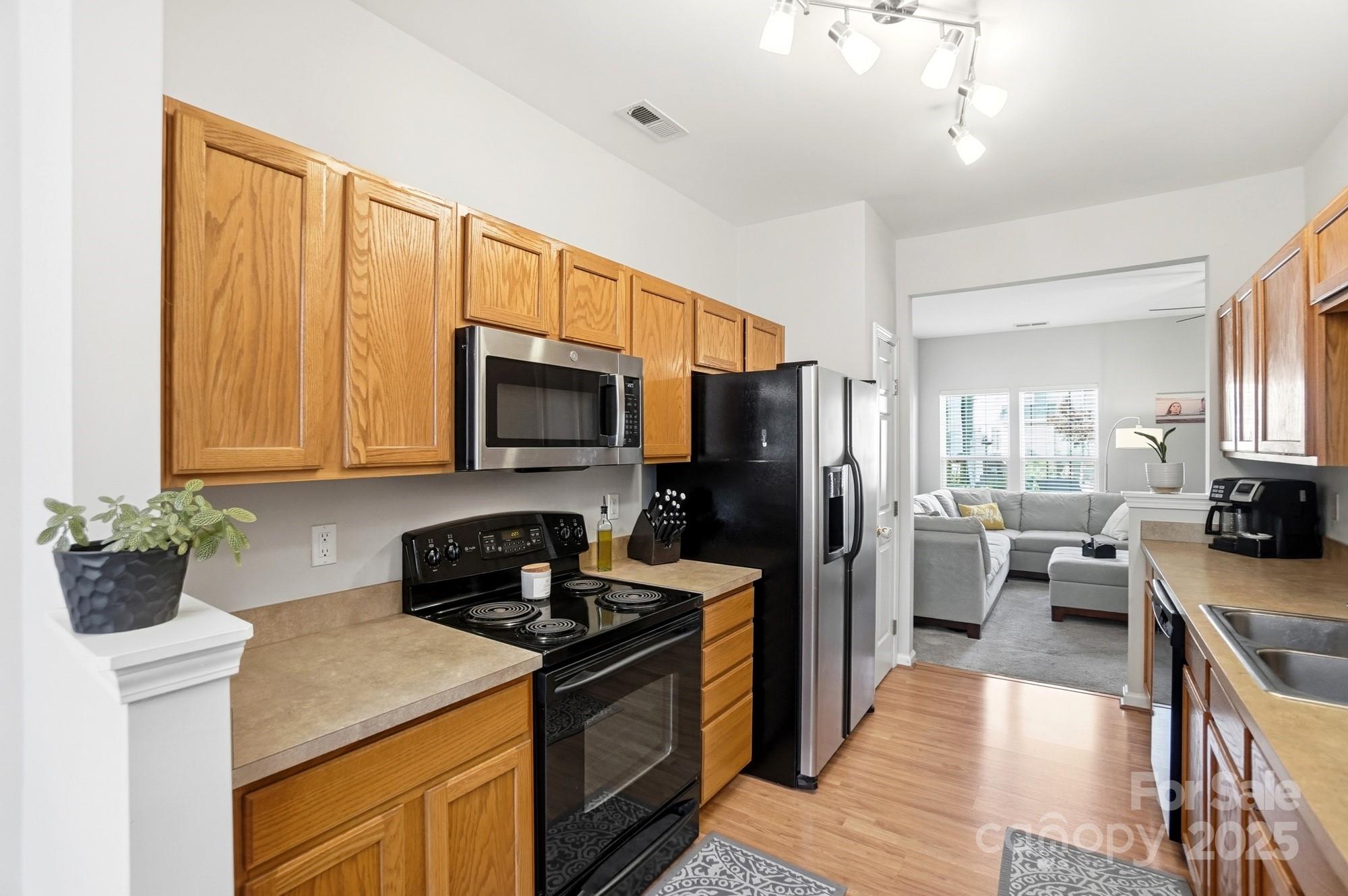 837 Dillard Road Rock Hill, SC 29730 - Photo 14 of 48 a kitchen with a stove a sink and a refrigerator