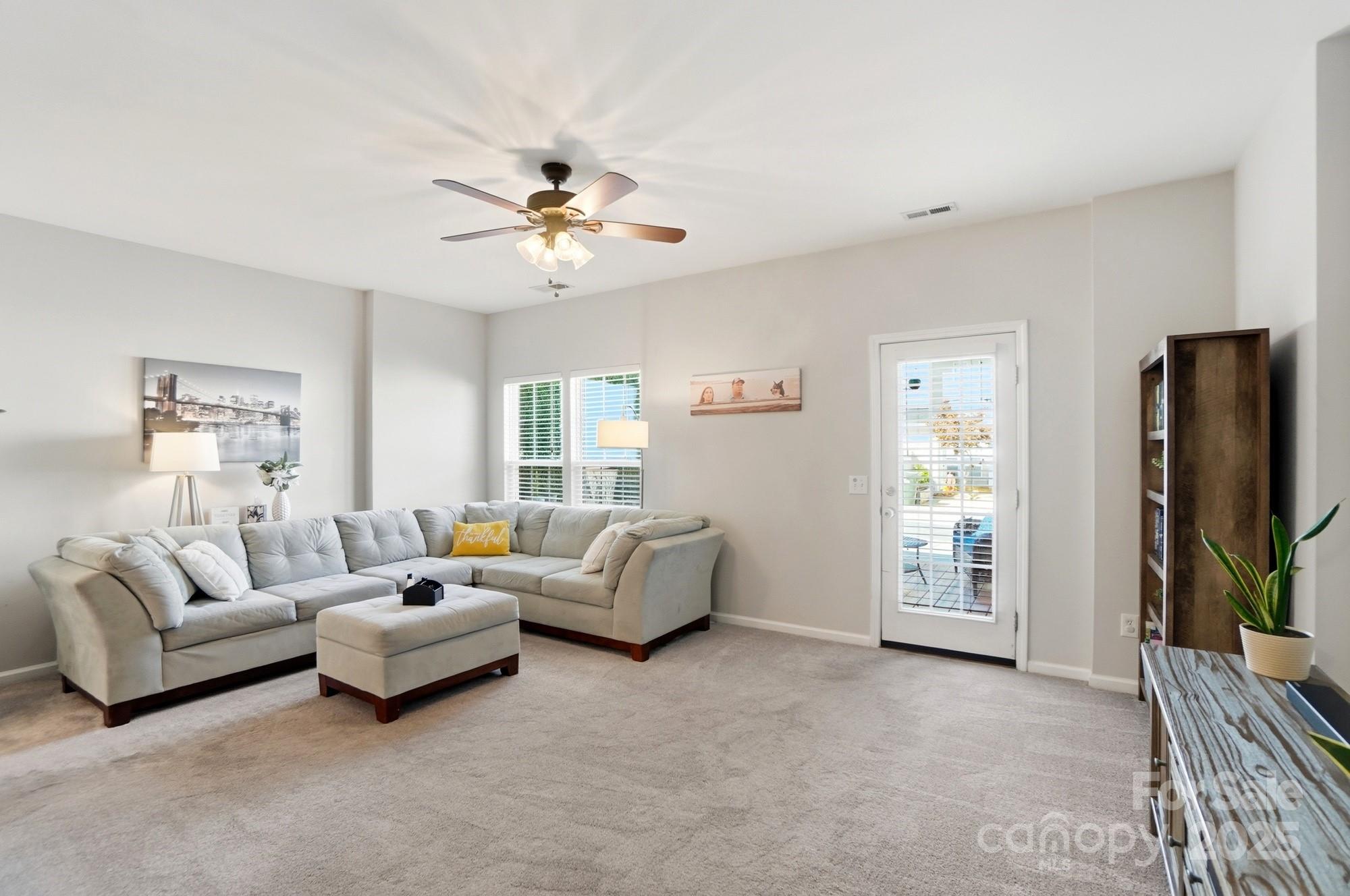 837 Dillard Road Rock Hill, SC 29730 - Photo 16 of 48 a living room with furniture and a flat screen tv