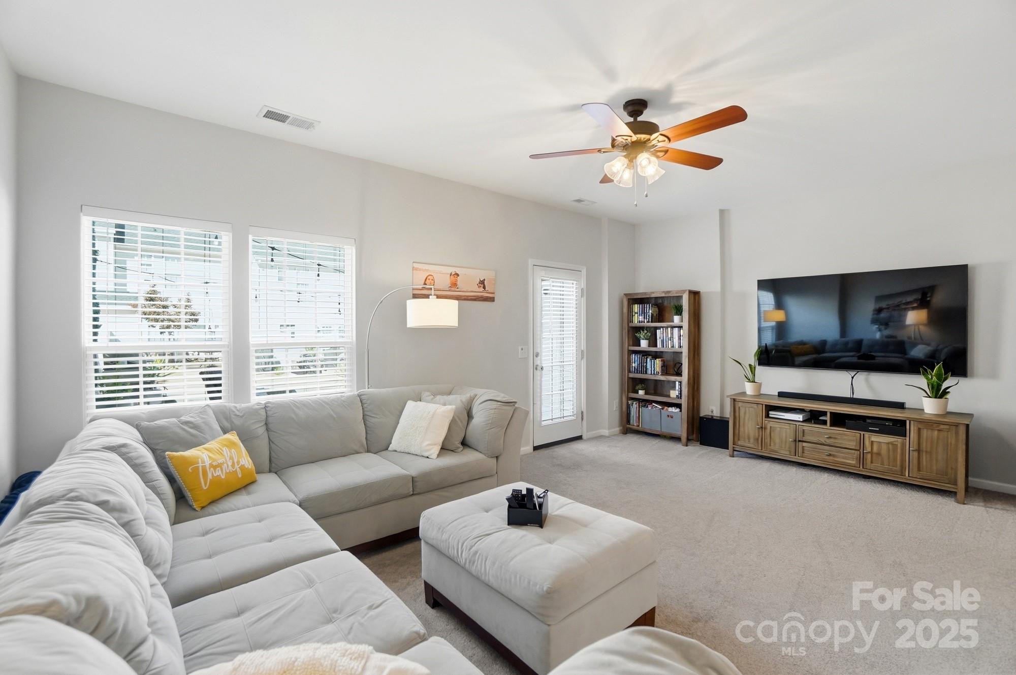 837 Dillard Road Rock Hill, SC 29730 - Photo 19 of 48 a living room with furniture and a flat screen tv