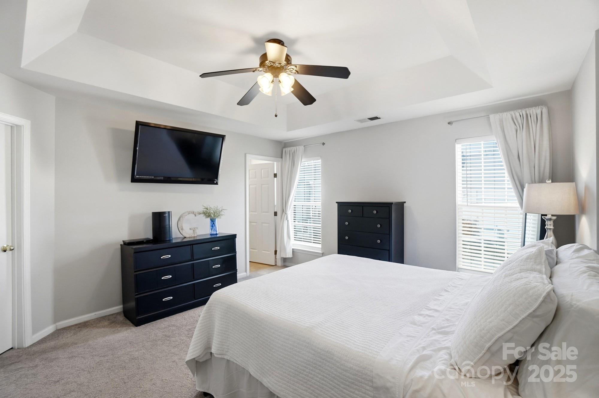 837 Dillard Road Rock Hill, SC 29730 - Photo 23 of 48 a bedroom with a bed and a flat screen tv