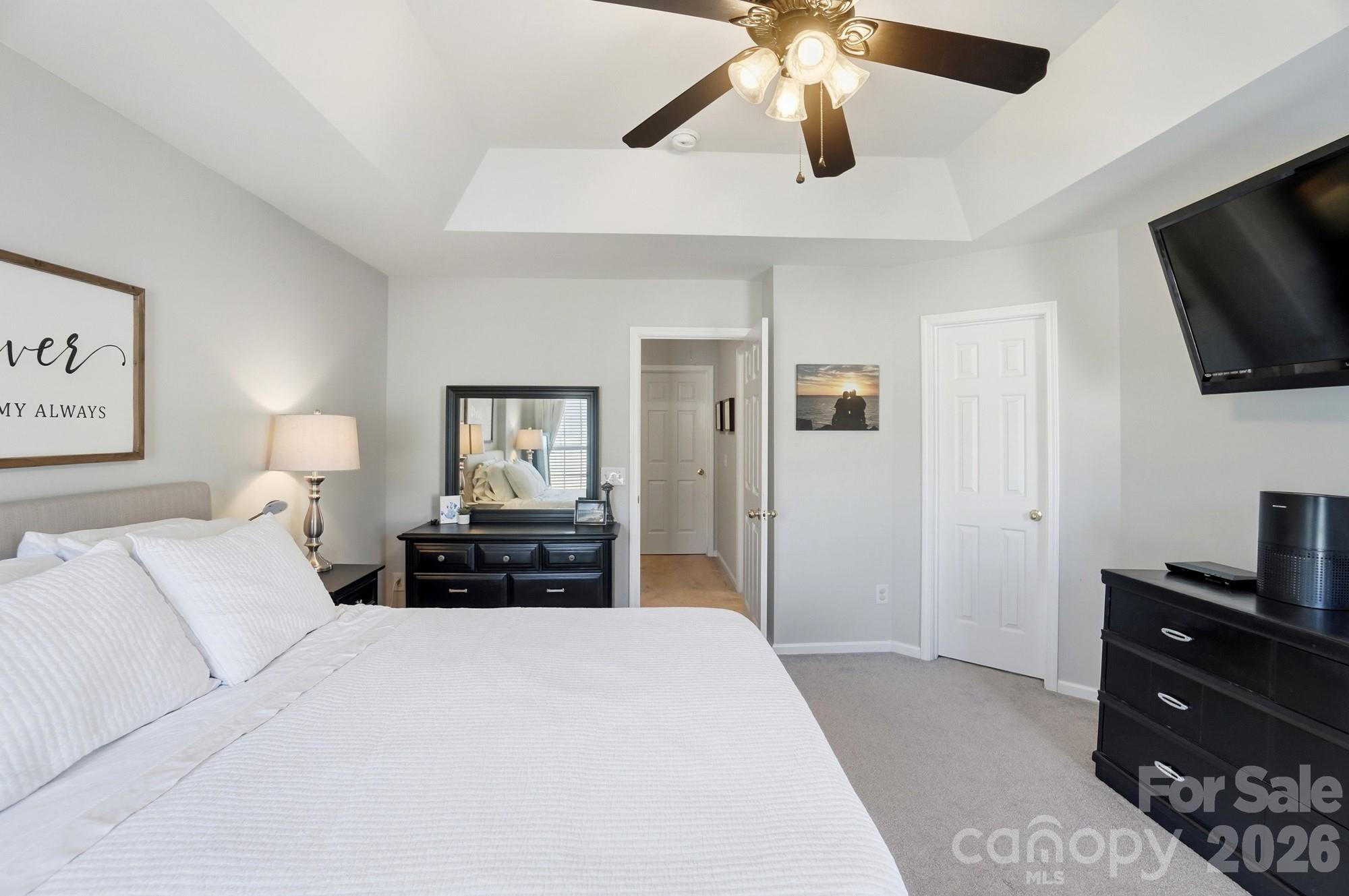 837 Dillard Road Rock Hill, SC 29730 - Photo 26 of 48 a bedroom with a bed and a flat tv screen on dresser