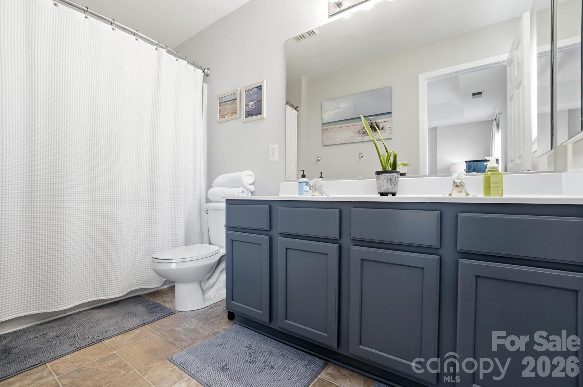 837 Dillard Road Rock Hill, SC 29730 - Photo 27 of 48 a bathroom with a toilet sink and mirror