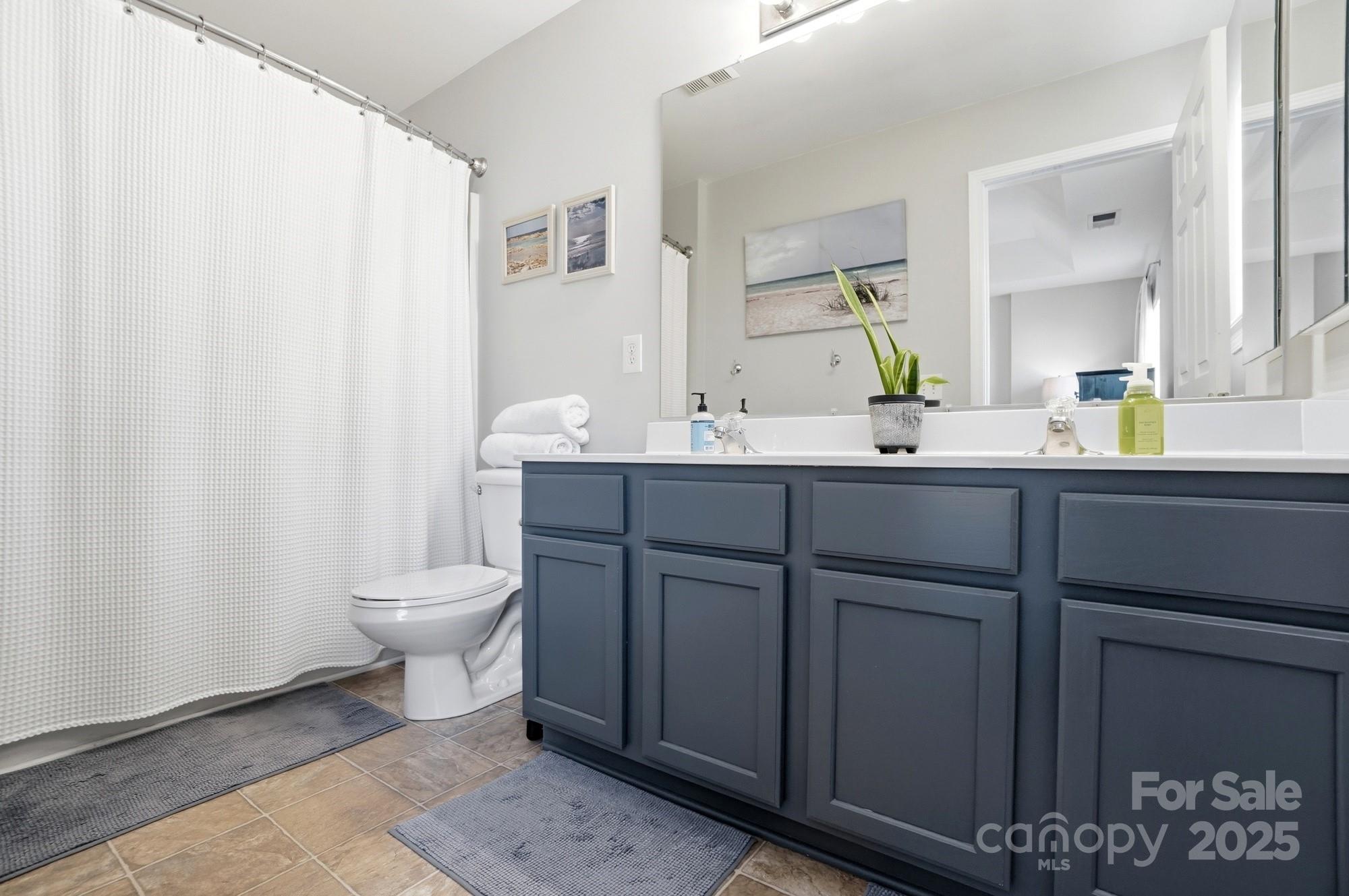 837 Dillard Road Rock Hill, SC 29730 - Photo 27 of 48 a bathroom with a toilet sink and mirror