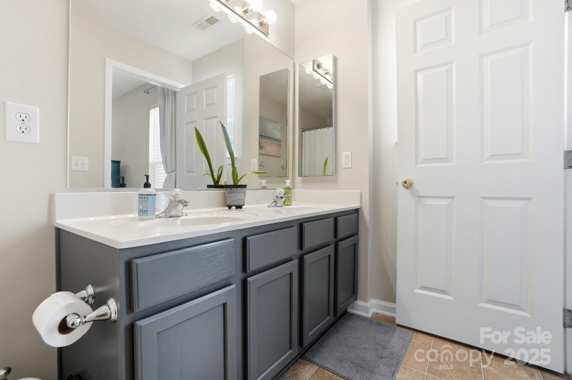 837 Dillard Road Rock Hill, SC 29730 - Photo 28 of 48 a bathroom with a sink vanity and a mirror