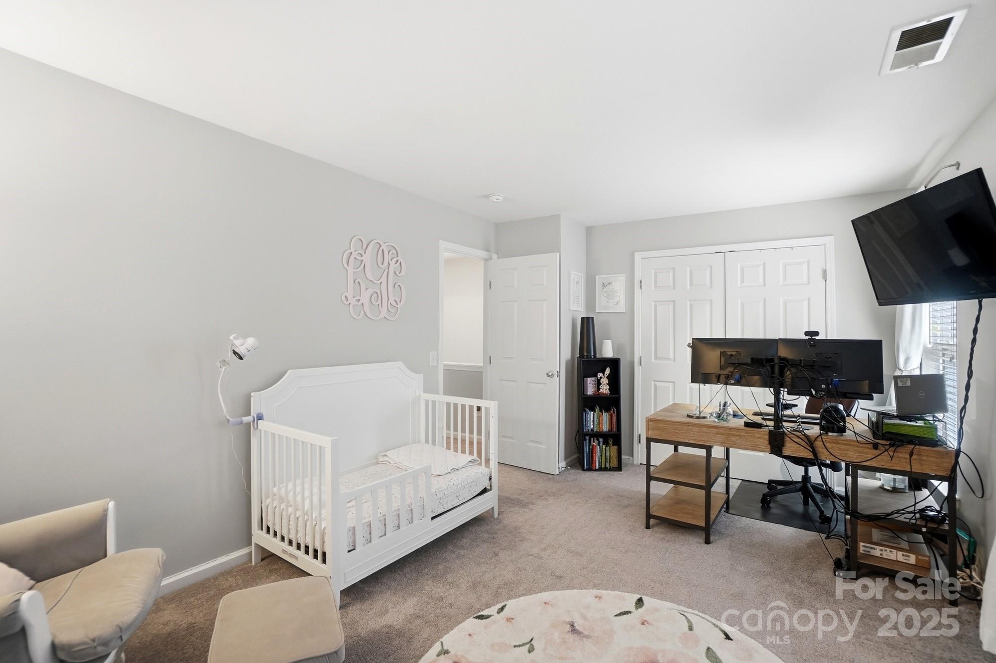 837 Dillard Road Rock Hill, SC 29730 - Photo 35 of 48 a bedroom with furniture and a flat screen tv