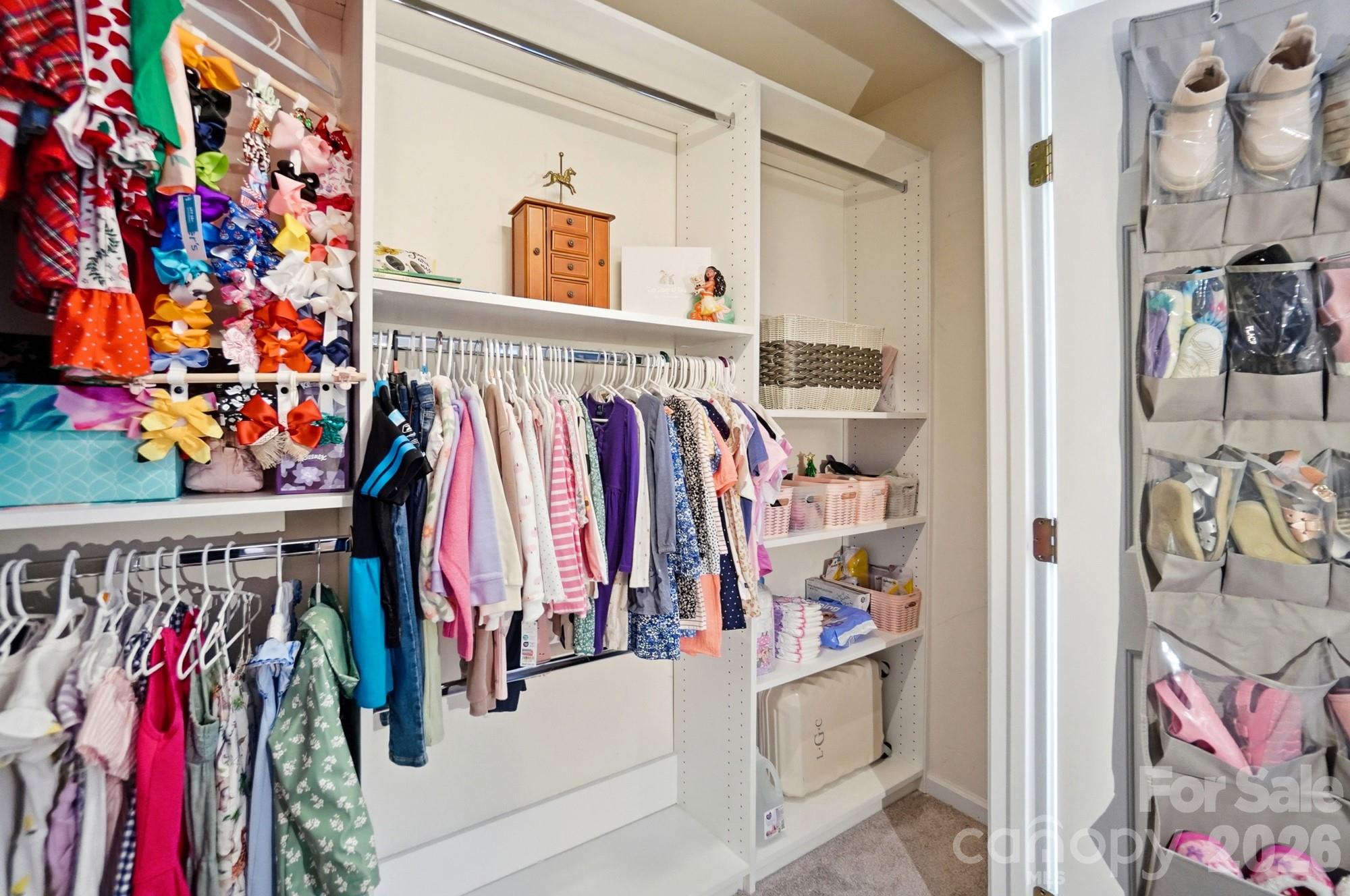 837 Dillard Road Rock Hill, SC 29730 - Photo 37 of 48 a view of walk in closet with clothes and shoes