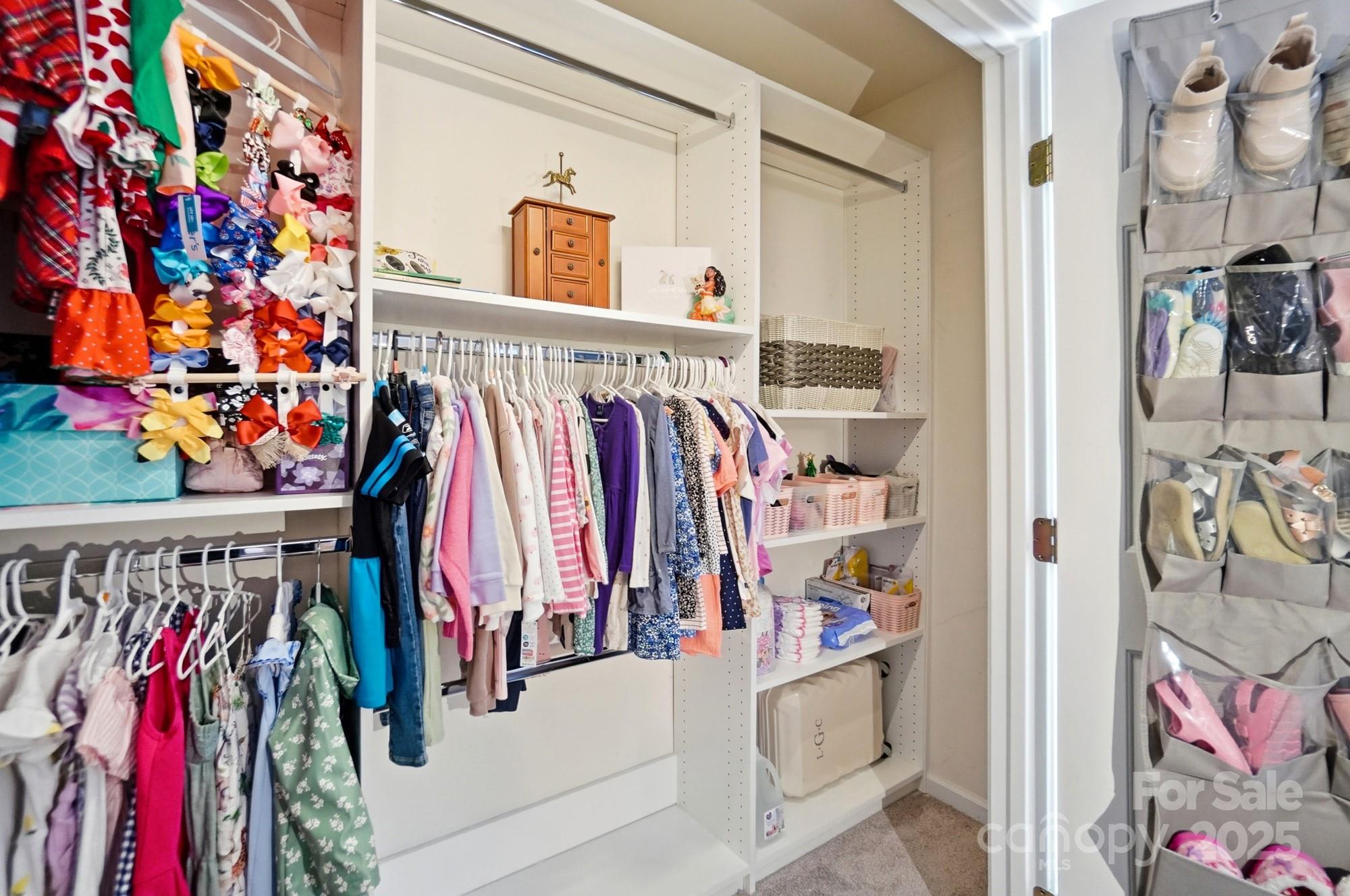 837 Dillard Road Rock Hill, SC 29730 - Photo 37 of 48 a view of walk in closet with clothes and shoes