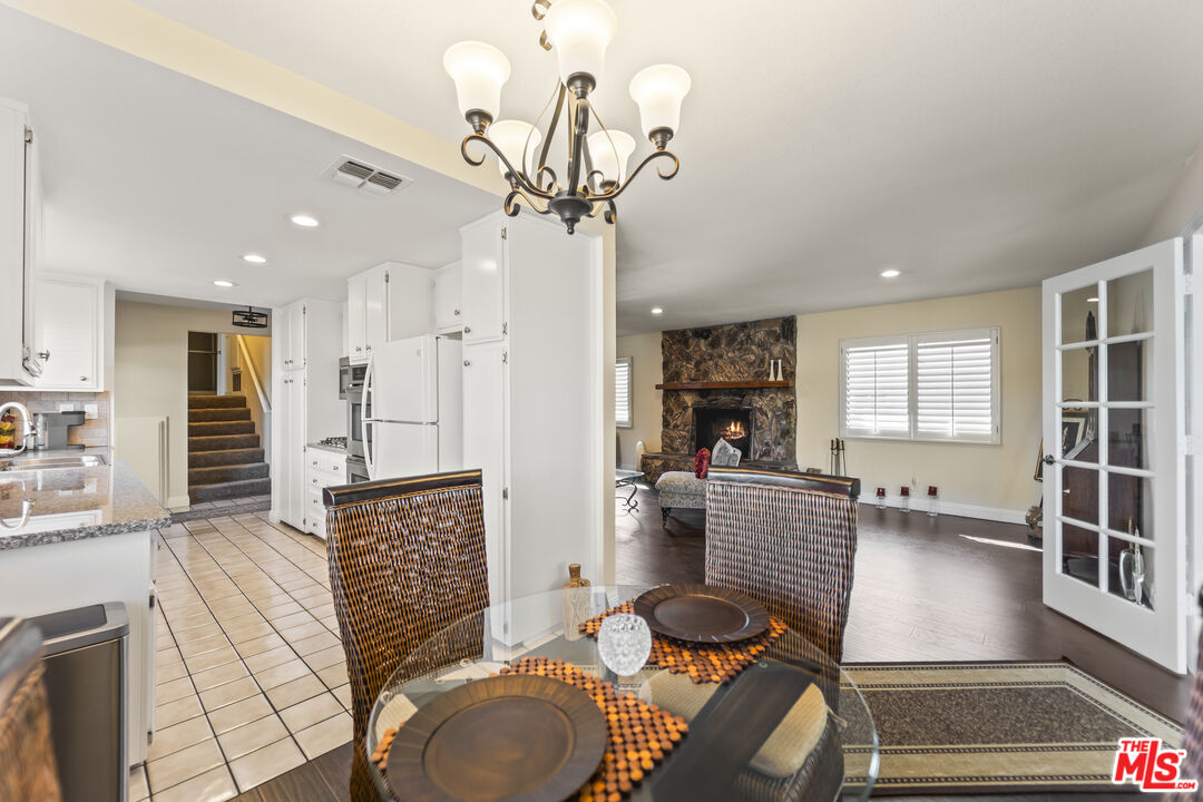 12896 Rain Shadow Road Victorville, CA 92395 - Photo 9 of 39 a living room with furniture a dining table and chairs