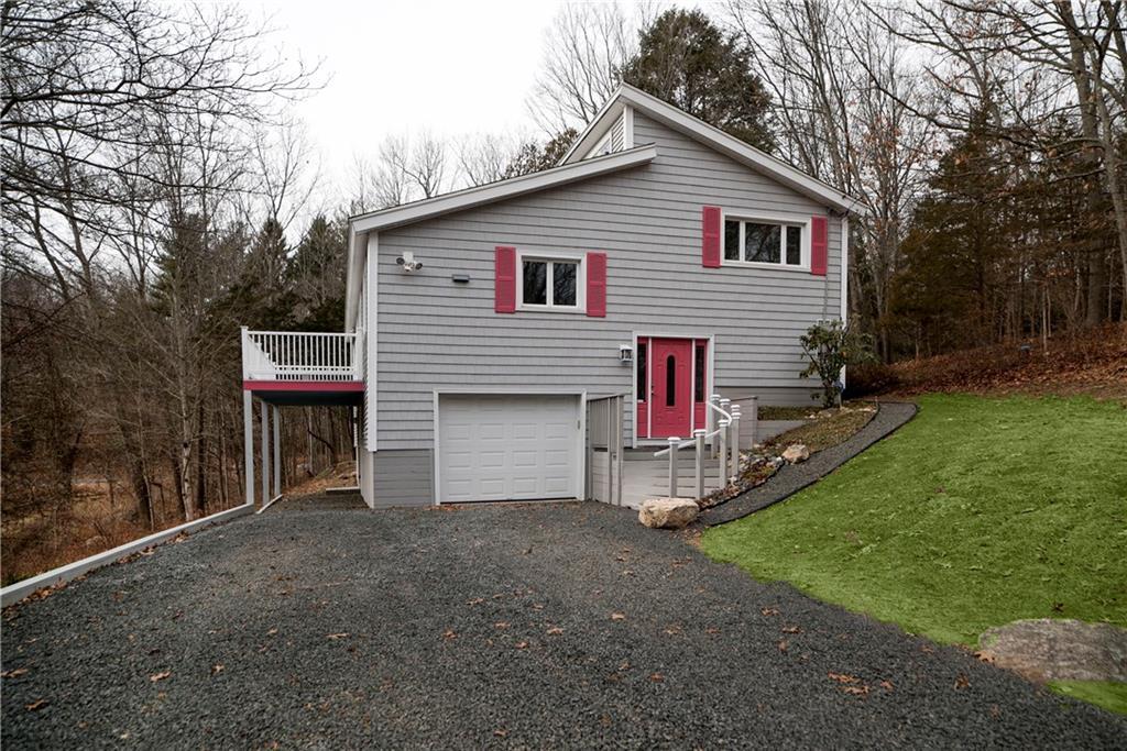 a view of house with yard and entertaining space
