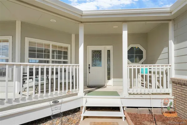 a view of a house with porch and wooden floor