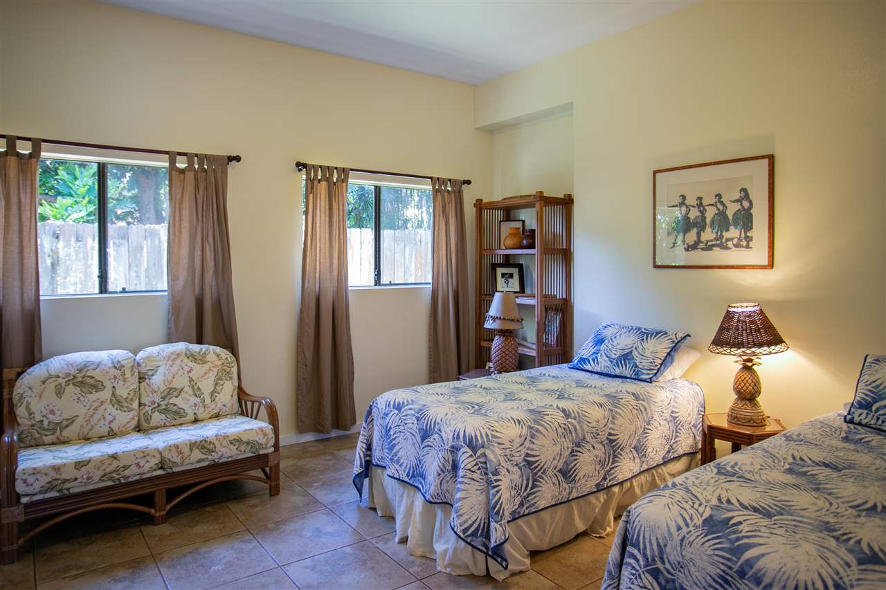 1555 West Kuiaha Road Haiku, HI 96708 - Photo 11 of 30 a bedroom with two beds and a window