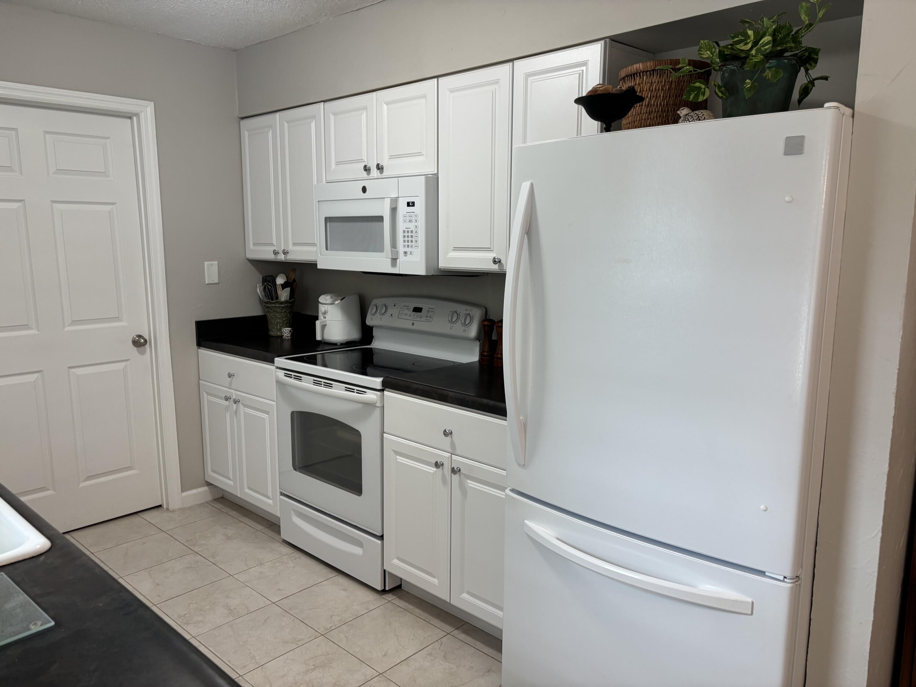 5367 Constitution Road Crestview, FL 32539 - Photo 13 of 25 a kitchen with stainless steel appliances a refrigerator sink and cabinets