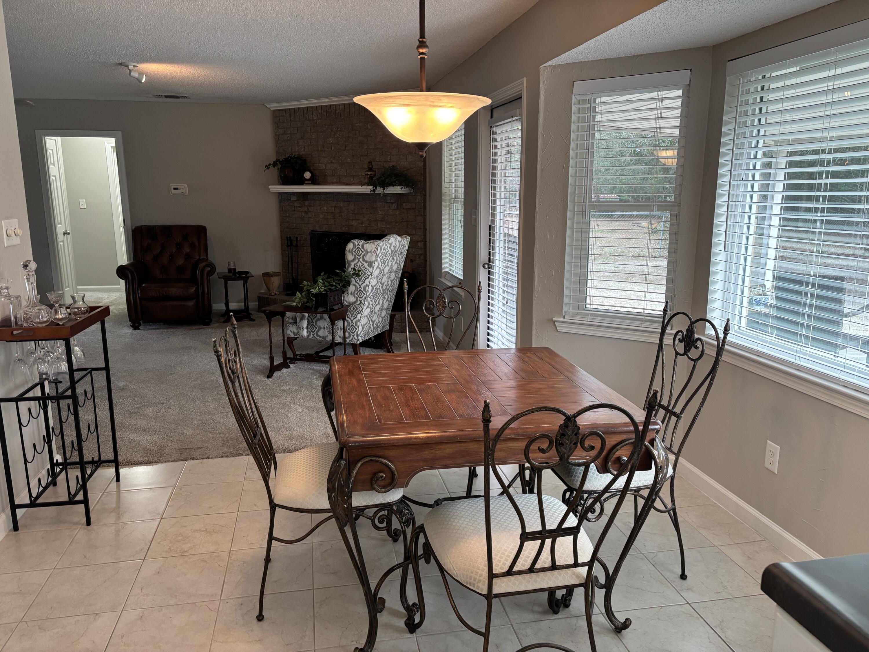 5367 Constitution Road Crestview, FL 32539 - Photo 14 of 25 a dining room with furniture and wooden floor