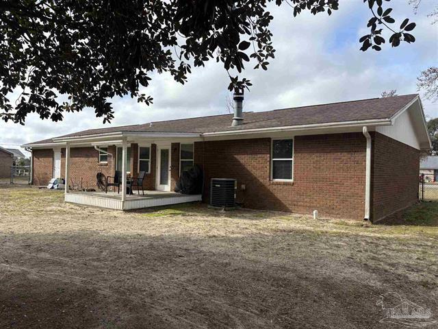 5367 Constitution Road Crestview, FL 32539 - Photo 23 of 25 a view of a house with a yard