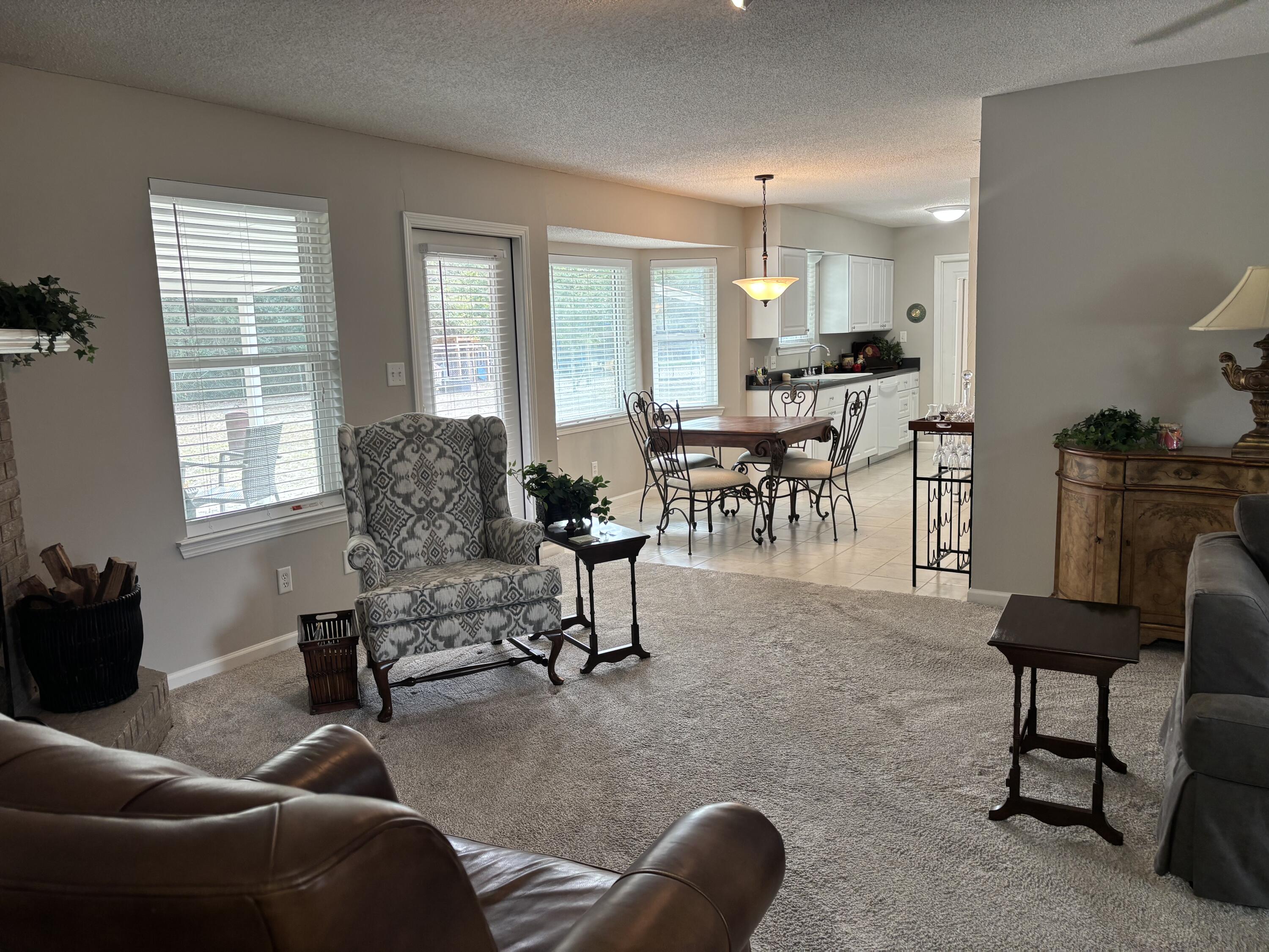5367 Constitution Road Crestview, FL 32539 - Photo 8 of 25 a living room with furniture and a large window
