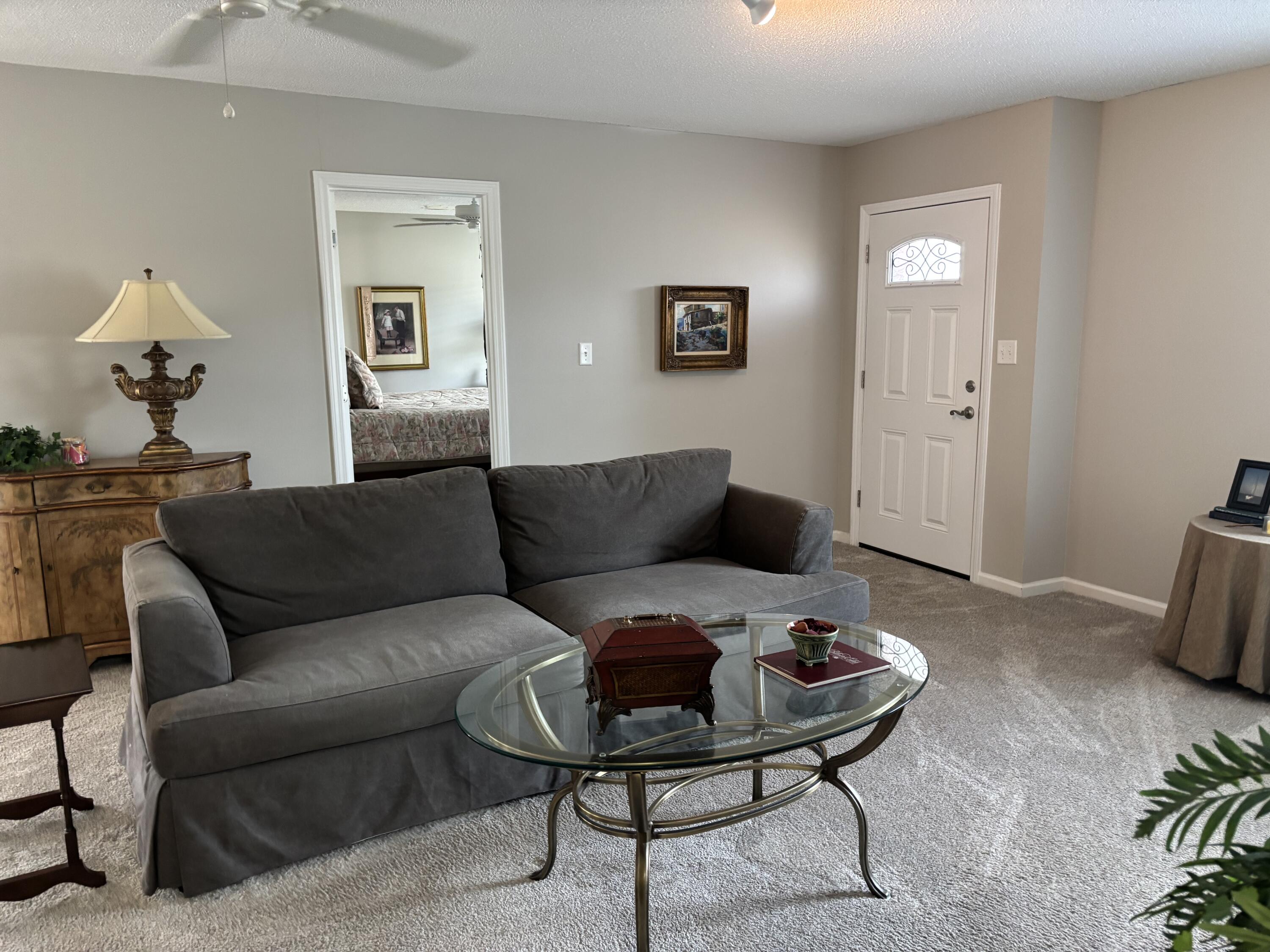 5367 Constitution Road Crestview, FL 32539 - Photo 9 of 25 a living room with furniture and a mirror