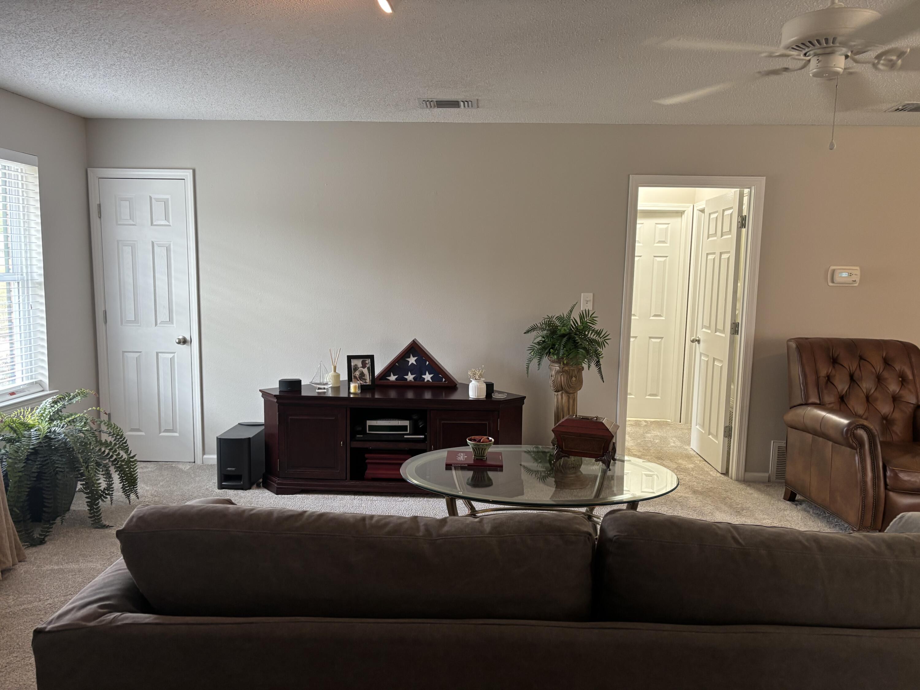 5367 Constitution Road Crestview, FL 32539 - Photo 10 of 25 a living room with furniture and a potted plant