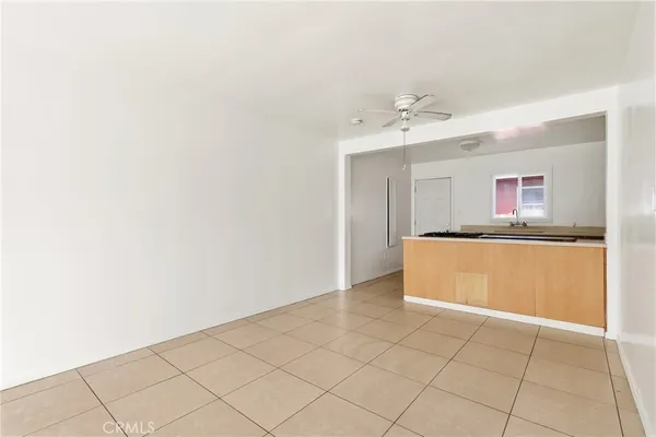 a kitchen with granite countertop a stove sink and cabinets