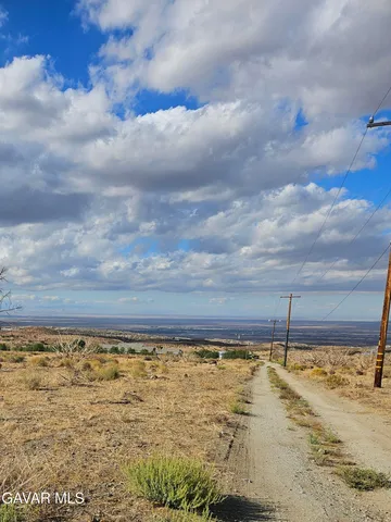 a view of a swimming pool and an outdoor seating