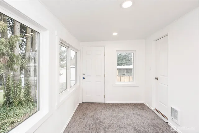 a view of an empty room with a window