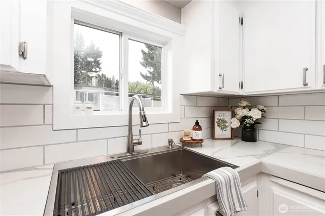 a kitchen with a stove and a window