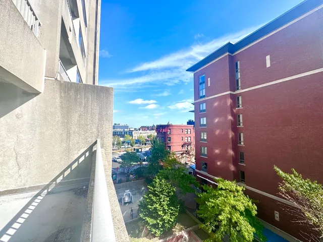 an outdoor space with patio furniture and white umbrellas