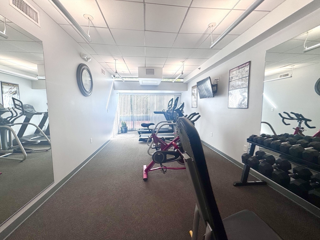 133 Park Street, Unit 404 Brookline, MA 02446 - Photo 19 of 25 a view of a room with gym equipment