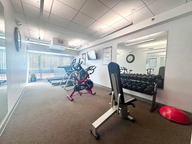 a view of a room with wooden floor and a sink